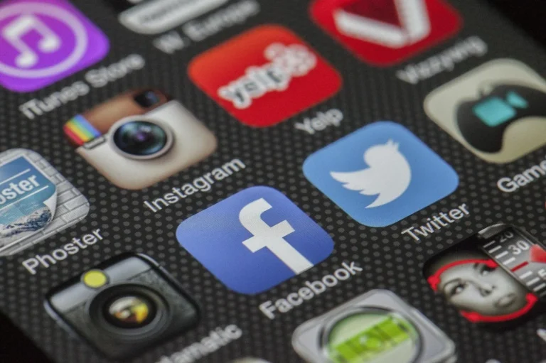 How to Use AI Tools for TikTok Content Creation: Step-by-Ste... — Close-up image of various social media app icons on a smartphone screen.