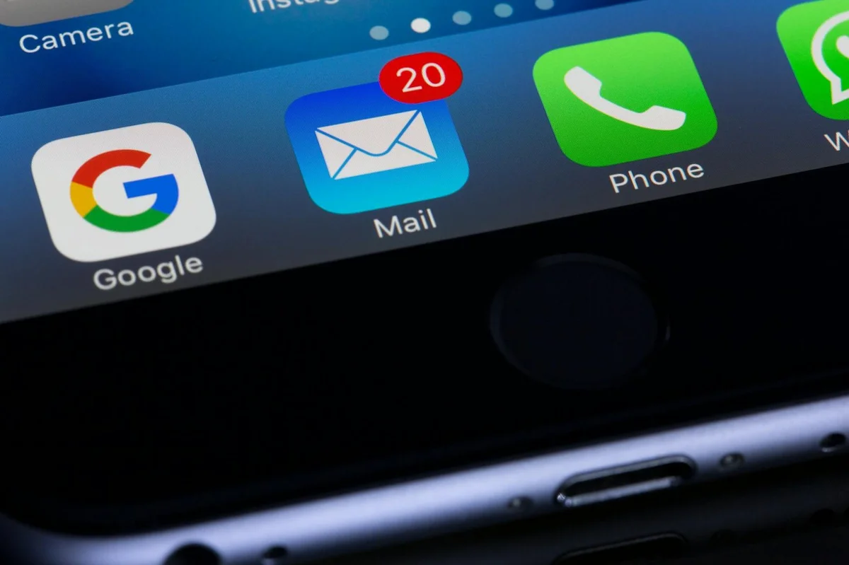 How to Optimize Your TikTok Profile for Maximum Follows: Ste... — A close-up photo of a smartphone displaying popular apps like Google and Mail.