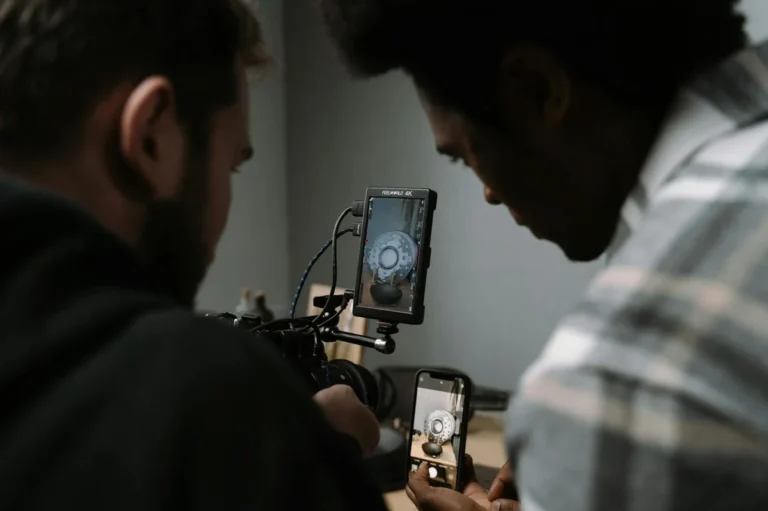 How to Choose the Right TikTok Content Format for Every Idea — Two men use cameras and smartphones to capture a close-up video in a studio sett