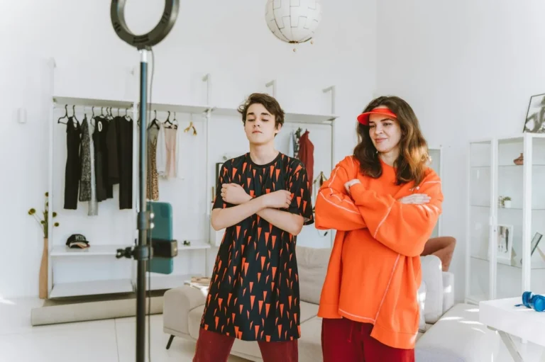 How to Secure Your TikTok Account Before You Grow: Complete... — A mother and son record a fun dance video at home using a smartphone and ring li