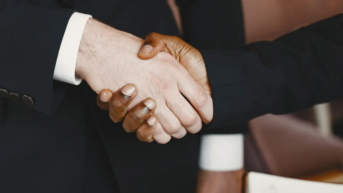 Close-up of a professional handshake symbolizing partnership and agreement.